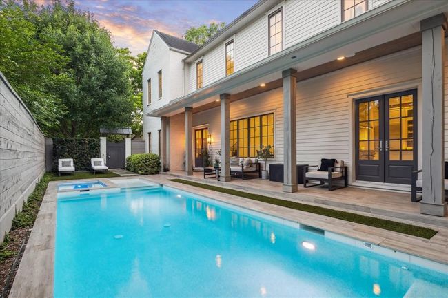 POOL GARDEN. With $35, 000 spent on landscaping, the multiple outdoor spaces are breathtaking. Heated pool and spa with outdoor seating. The corner lot means no neighbors to the east making this area exceptionally private. New fence in 2024. | Image 31