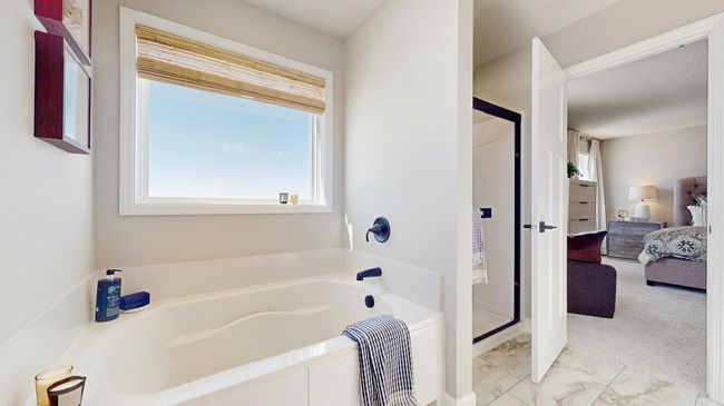 (Photo of a model home, actual features may vary) Relax in your private oasis with a separate shower and soaking tub in the owner's bath. | Image 10