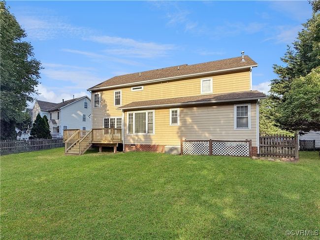 Back of house with a deck and crawl space | Image 22