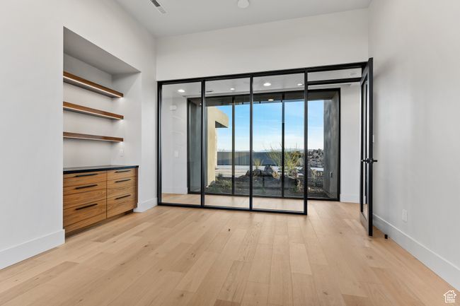 Interior space with light wood-style flooring and baseboards | Image 20