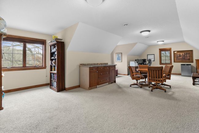Upper-level bonus room or private office. Large 30' x 18' area is above attached garage and access from back stairway from main level hallway. Be sure not to miss this during showing. Wired LAN available. | Image 38