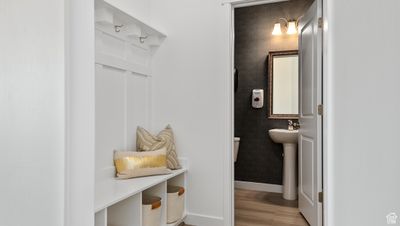 Bathroom featuring sink and hardwood / wood-style flooring | Image 3