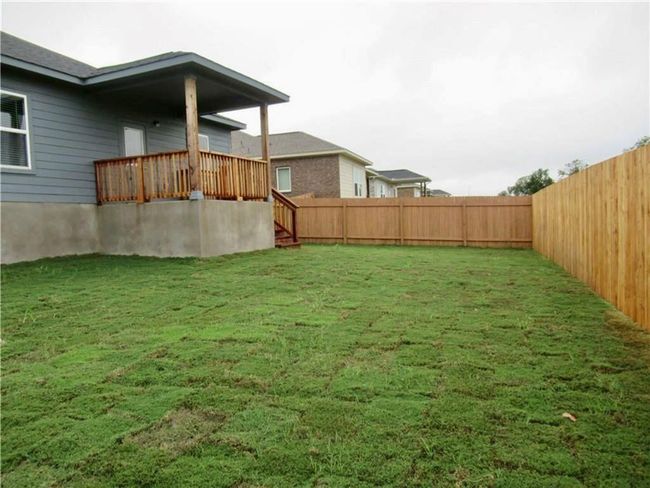 View of fenced backyard | Image 16