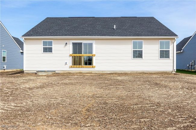 Back of house with a shingled roof | Image 33