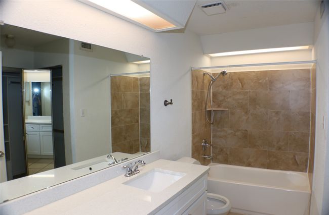 Full bathroom with vanity and tub / shower combination | Image 27