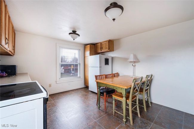 Dining room with baseboards | Image 32