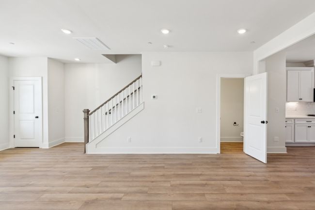 Notice all the niceties included in your home-- the painted spindles on the stairs, the craftsman trim throughout the home, the coat closet at the front door, the ample lighting everywhere! Actual photo of home. | Image 8