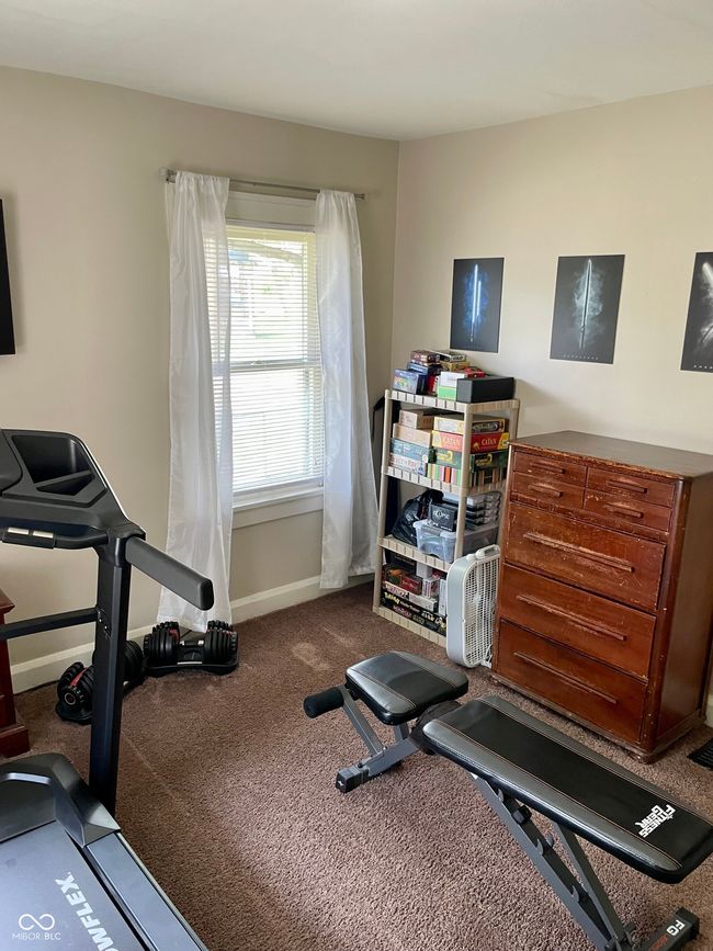 workout area featuring carpet flooring and baseboards | Image 19