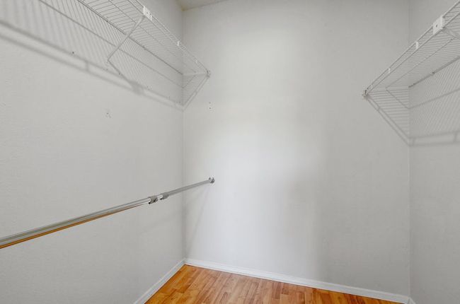 Large walk-in closet in secondary bedroom. | Image 20