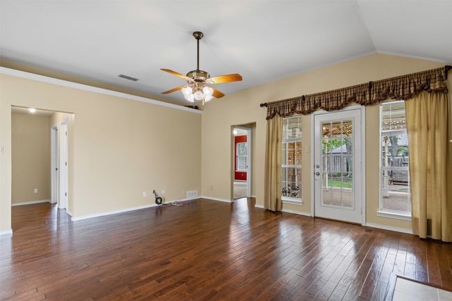 Open floor plan living area with views of backyard. | Image 12