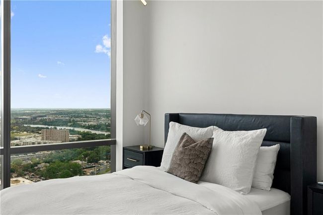 Bedroom featuring a view of city | Image 14
