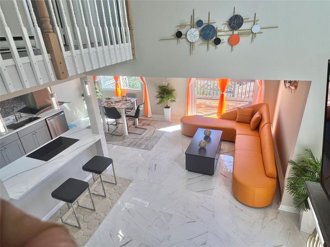 Living area featuring marble finish floor and baseboards | Image 31