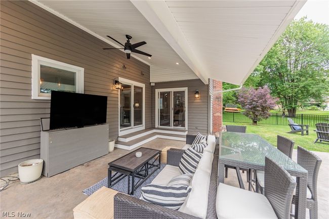 View of patio with ceiling fan and an outdoor living space | Image 46