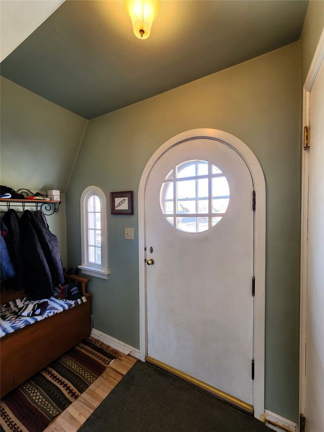 Foyer entrance featuring baseboards, lofted ceiling, and wood finished floors | Image 14
