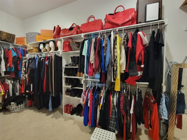 Spacious walk-in closet with carpet flooring | Image 21