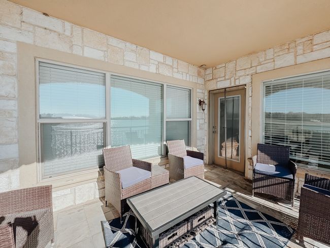 View of patio / terrace with an outdoor hangout area. | Image 24