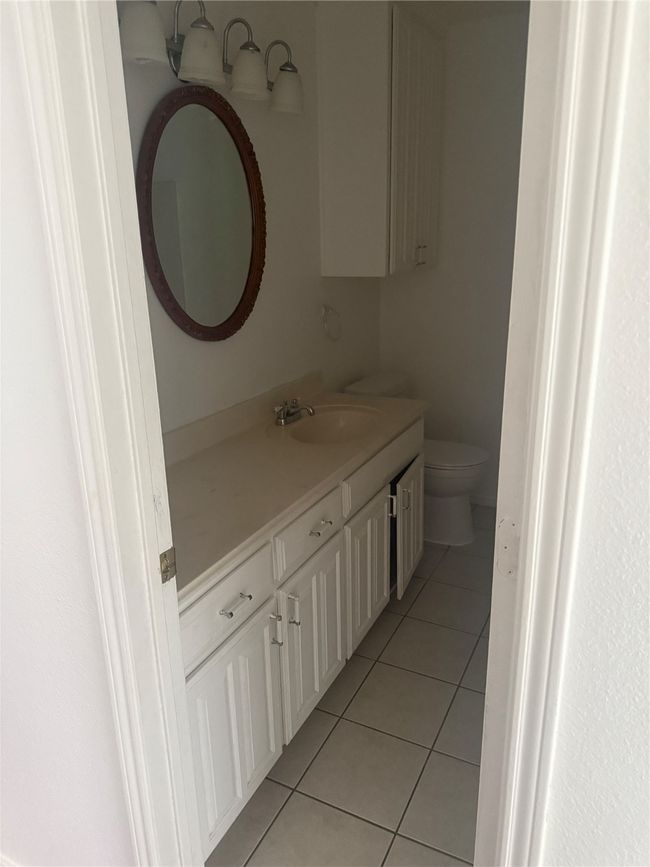 Bathroom with tile patterned floors, vanity, and toilet | Image 18