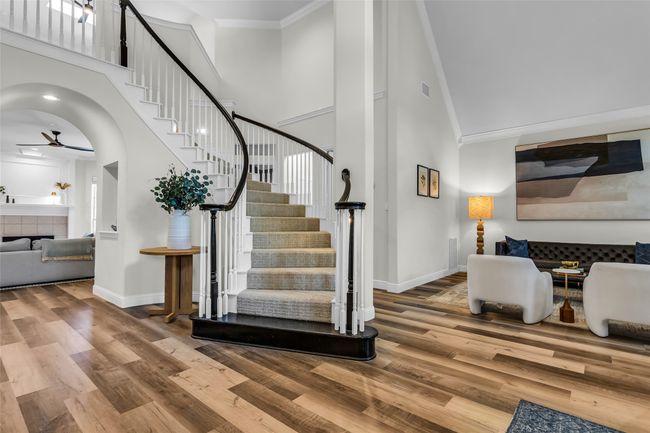 Dramatic Two Story Entry Has Winding Staircase and Split Formals! | Image 4