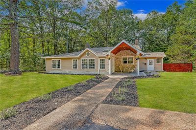 Ranch-style house featuring a front yard | Image 1