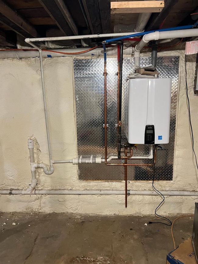 Utility room with tankless water heater | Image 28