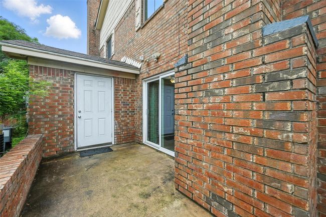 Doorway to property with brick siding | Image 18