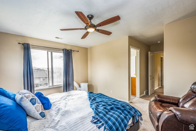 Carpeted bedroom with baseboards and a ceiling fan | Image 18