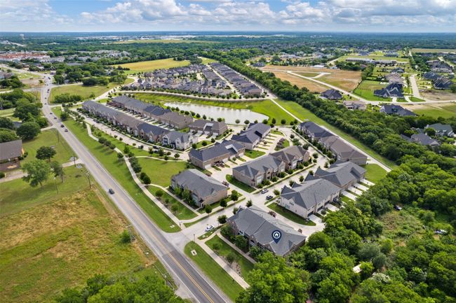 Aerial perspective of suburban area featuring a nearby body of water | Image 31