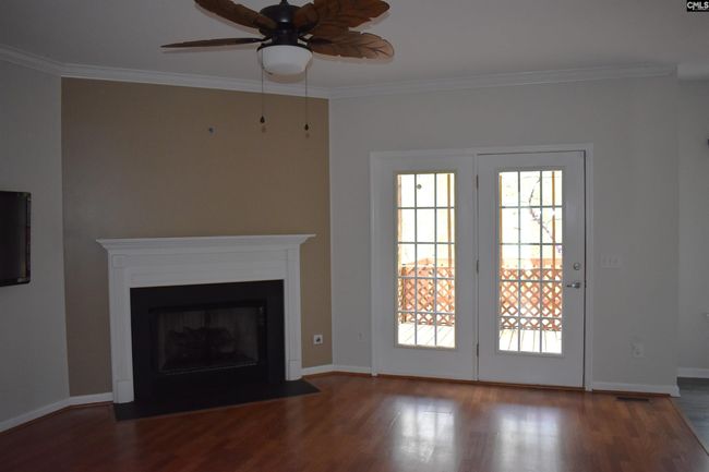 Living room with view of french doors leading to the screened porch | Image 4