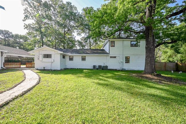 The backyard, behind the house, is perfect for entertainment, large gatherings, and a spacious place for the kids and pets to run and play. | Image 28