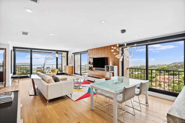 Rare one-of-a-kind completely remodeled 12th floor END-UNIT with North AND West facing full-size glass doors that showcase amazing views. | Image 4