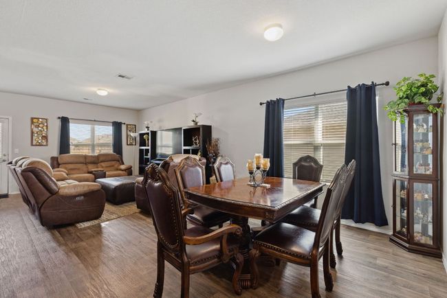 Dining room featuring wood-vinyl finished floors | Image 26