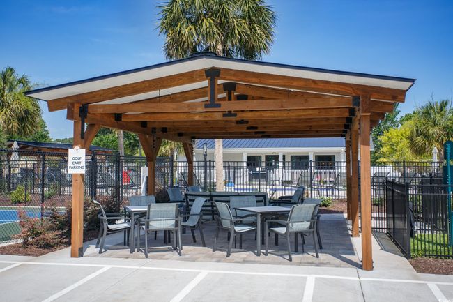 View of patio with a gazebo and outdoor dining space | Image 38