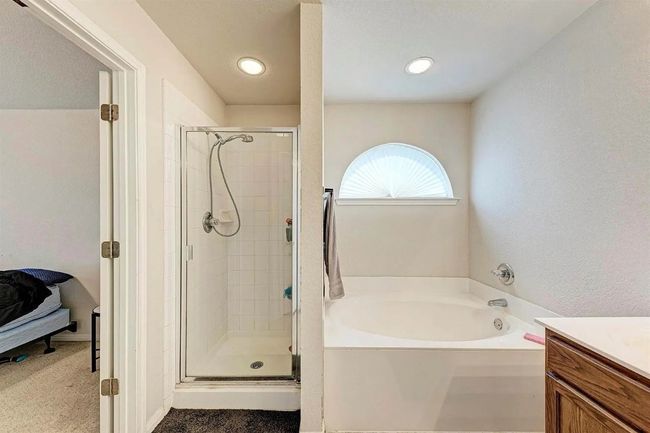 Bathroom featuring a garden tub, a shower stall, vanity, and recessed lighting | Image 5