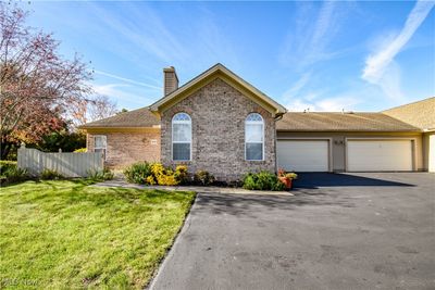 View of front of property with a front yard and a garage | Image 2