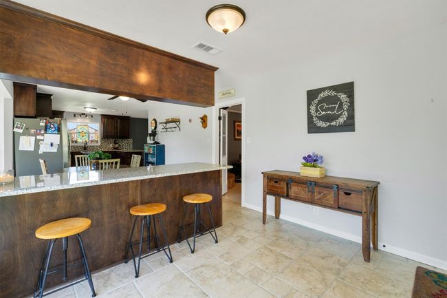This extension from the kitchen is easily a play area, hobby spot, office or any other number of uses. | Image 16