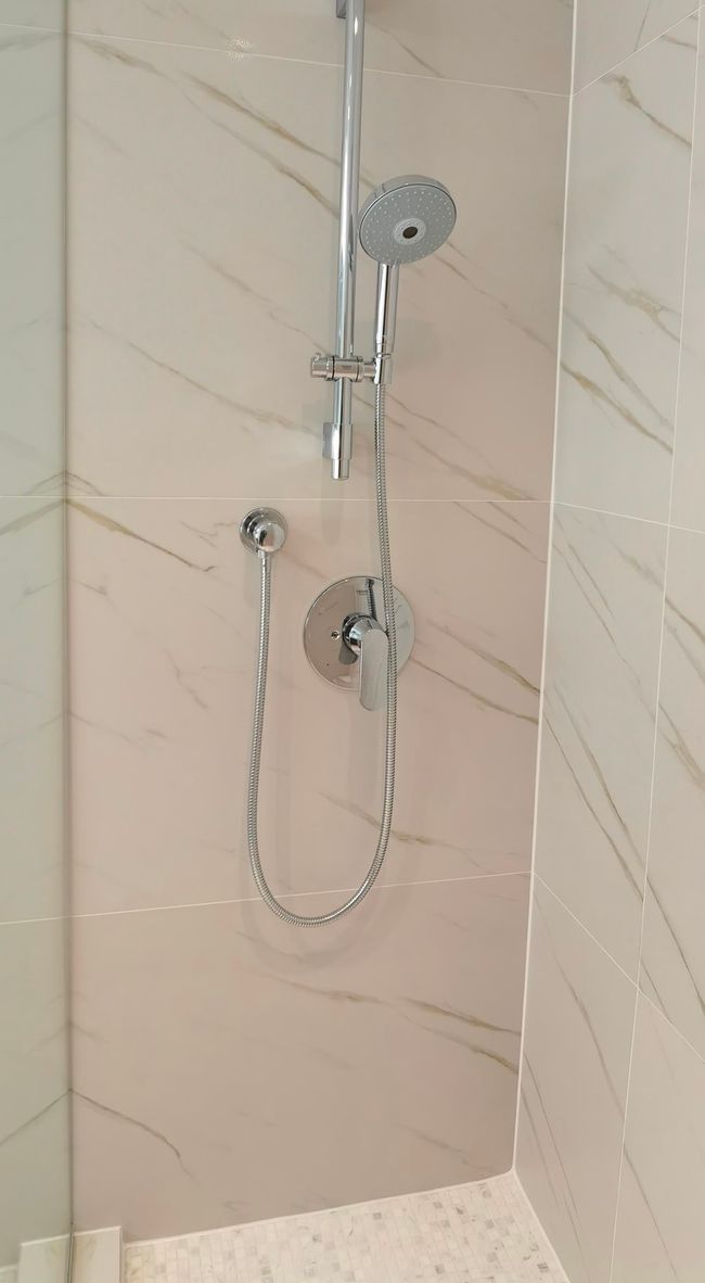 Bathroom view of a marble finish shower | Image 15