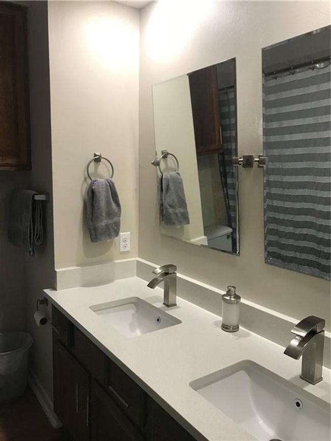 Bathroom featuring double vanity | Image 10