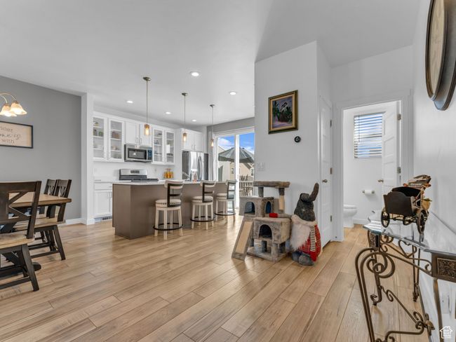 Living room featuring light wood-style floors and recessed lighting | Image 15
