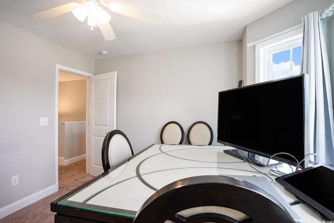 Carpeted bedroom with baseboards and ceiling fan | Image 23
