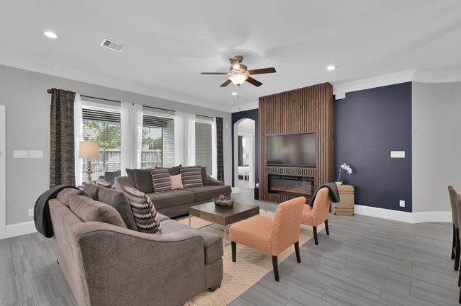 Family room overlooks pool w/ CUSTOM built-in TV and Fireplace. | Image 5