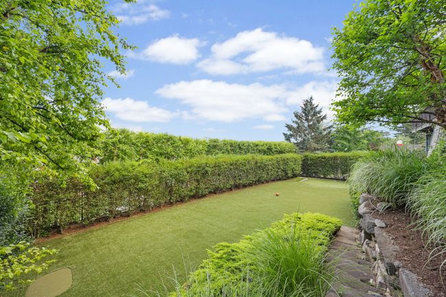 Backyard turf/putting green play area. | Image 30
