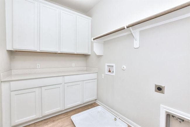 Garage featuring a garage door opener | Image 22