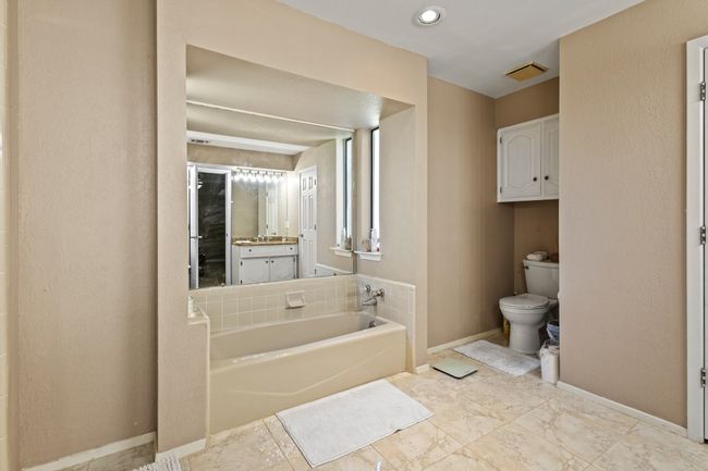 Full bath with a garden tub and vanity | Image 16