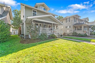 View of front of house featuring a front yard, cooling unit, and a porch | Image 2