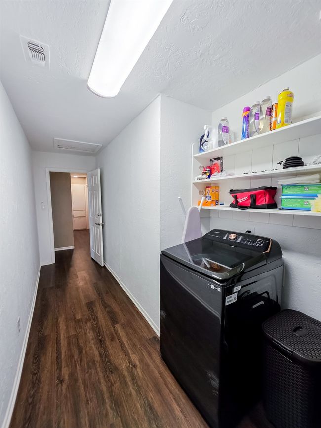 Hallway featuring wood finished floors, baseboards, and attic access | Image 20