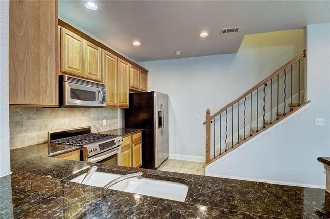 KITCHEN LEADS TO UPSTAIRS | Image 11
