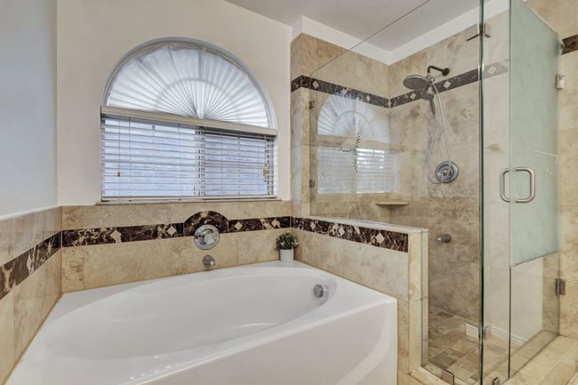 Bathroom featuring independent shower and bath | Image 25