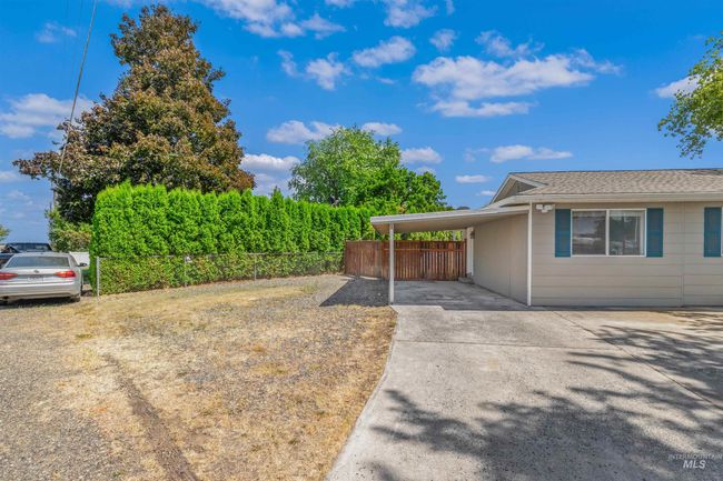 View of side of home with a carport and driveway | Image 32