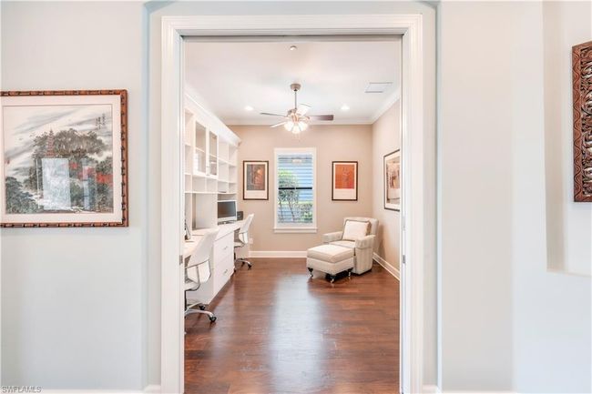 Living area featuring ceiling fan, wood finished floors, crown molding, baseboards, and recessed lighting | Image 17