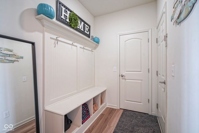 mudroom with baseboards and wood finished floors | Image 12
